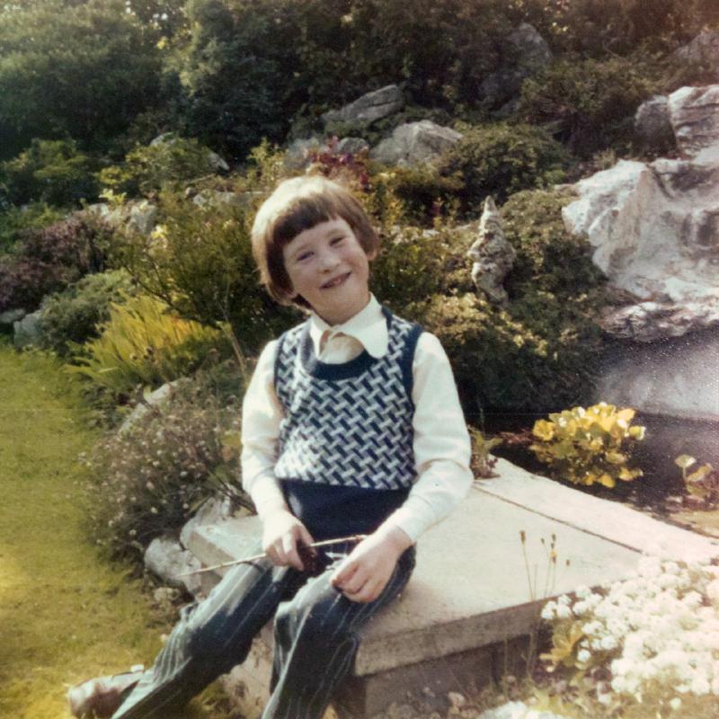 Little girl lying on grass